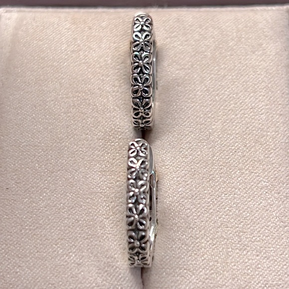 Sparkle in these Sterling Silver & Diamond Hoop Earrings with 14k Gold accents. - Picture 3 of 7
